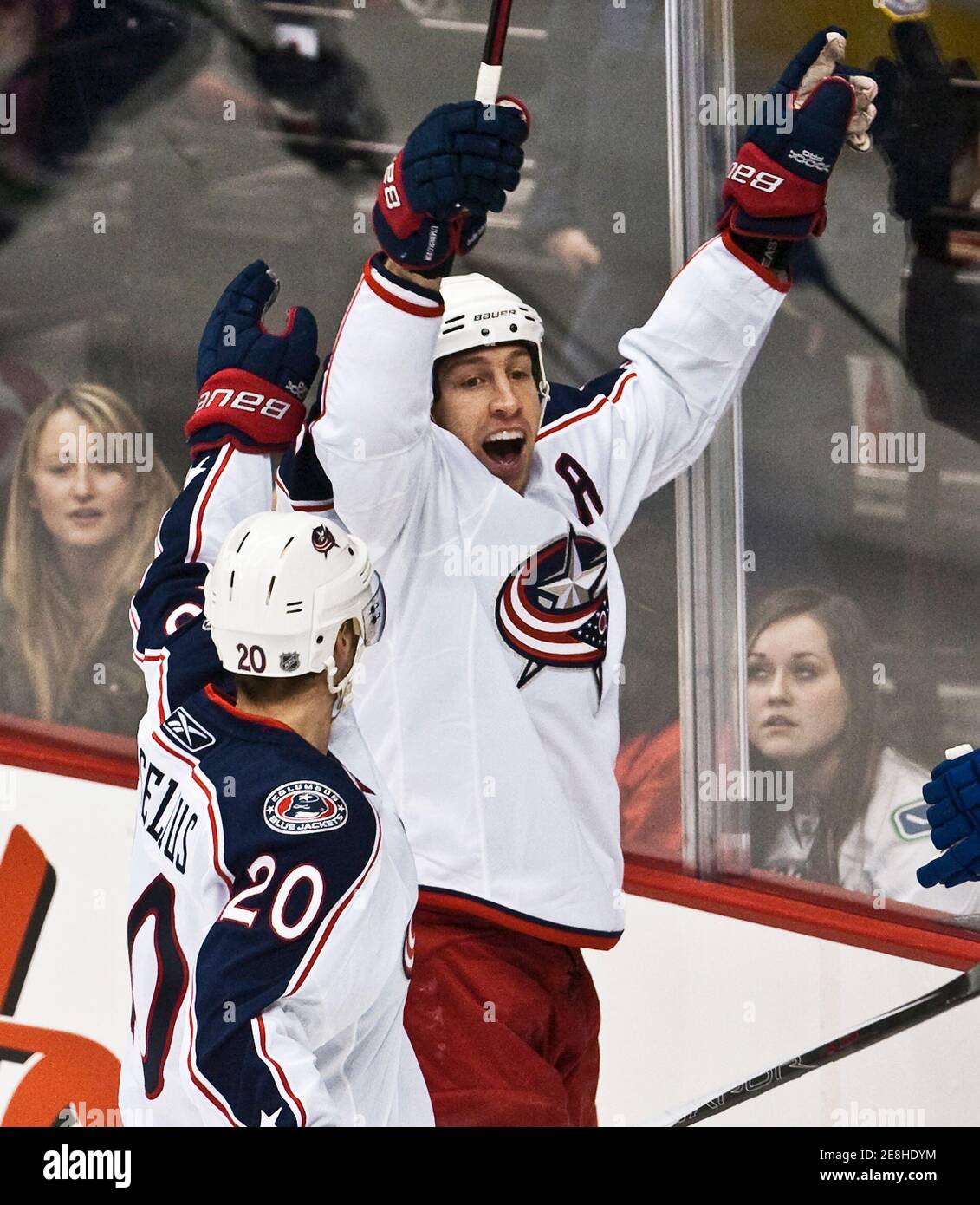Columbus Blue Jackets RJ Umberger celebrates his goal with team mate Kristian Huselius against the Vancouver Canucks during first period NHL hockey action in Vancouver, British Columbia, January 5, 2010.          REUTERS/Andy Clark     (CANADA - Tags: SPORT ICE HOCKEY) Stock Photo
