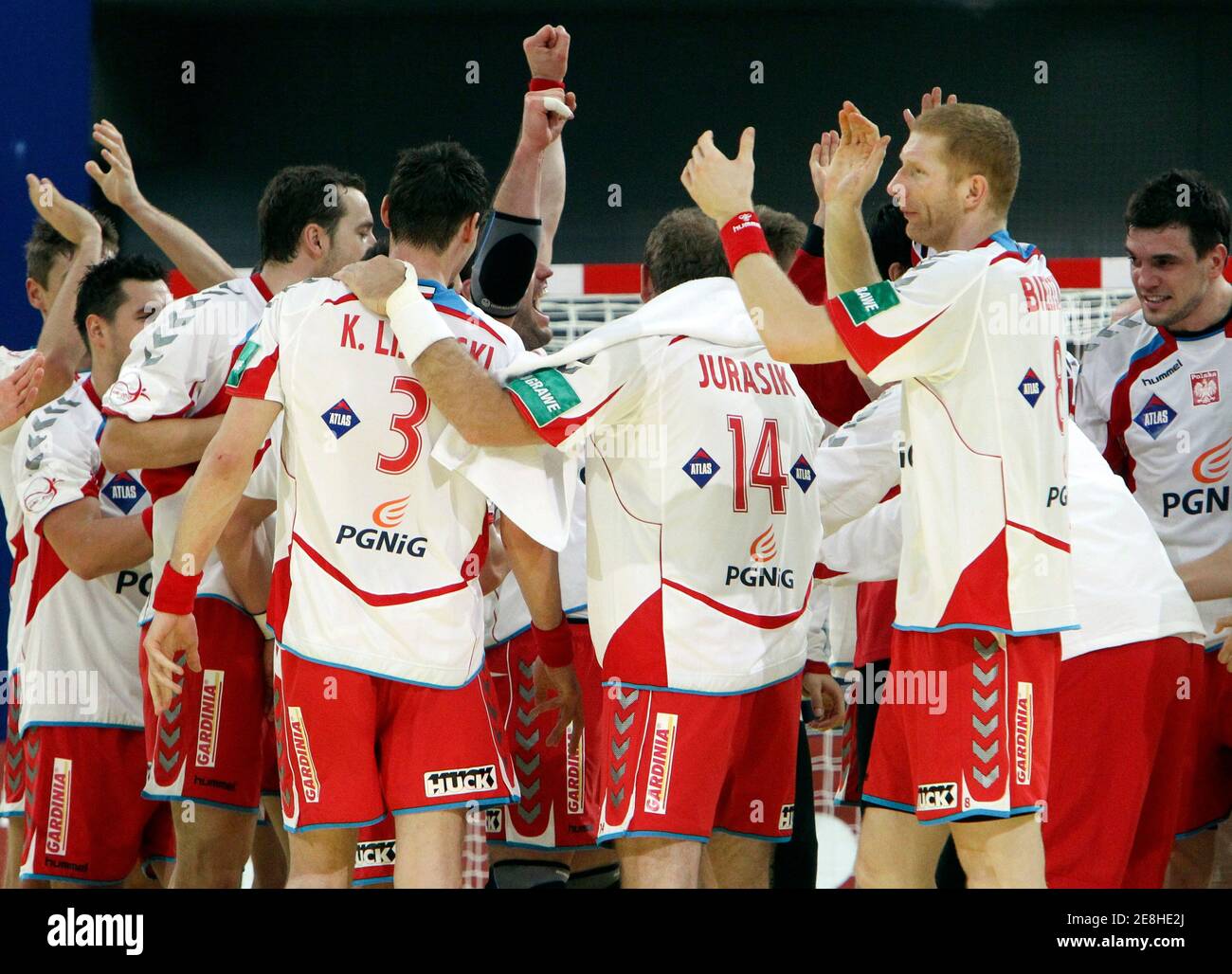 Poland's players celebrate their victory after their Men's European Handball Championship group C match against Sweden in Innsbruck, January 20, 2010.  REUTERS/Oleg Popov (AUSTRIA - Tags: SPORT HANDBALL) Stock Photo
