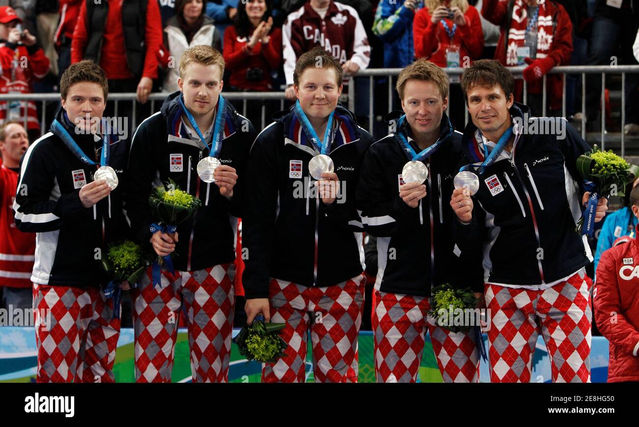 Norway's skip Thomas Ulsrud (R-L), Torger Nergaard, Christoffer Svae, Haavard Vad Petersson and alternate Thomas Loevold celebrate with their silver medals after their men's gold medal curling game against Canada at the Vancouver 2010 Winter Olympics February 27, 2010.     REUTERS/Andy Clark (CANADA) Stock Photo