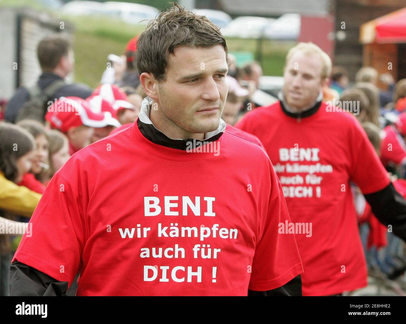 Switzerland's national soccer team players Alexander Frei (L) and Ludovic Magnin show off T-shirts written 'Beni, we also play for you' during a pre-World Cup training session in Freienbach, June2, 2006. Benjamin Huggel, called Beni, was suspended for six games with the national soccer team after the incidents following the barrage World Cup match against Turkey in Istanbul last year. WORLD CUP 2006 PREVIEW REUTERS/Pascal Lauener (SWITZERLAND) Stock Photo