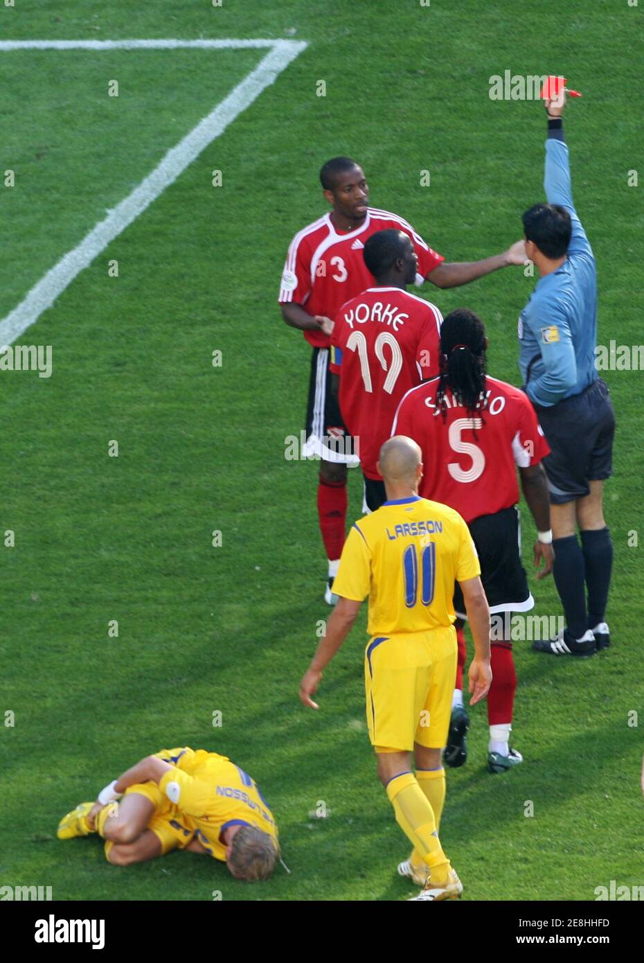 Referee Shamsul Maidin Of Singapore Shows Trinidad And Tobago S Avery John 3 A Red Card During Their Group B World Cup 06 Soccer Match Against Sweden In Dortmund June 10 06 John