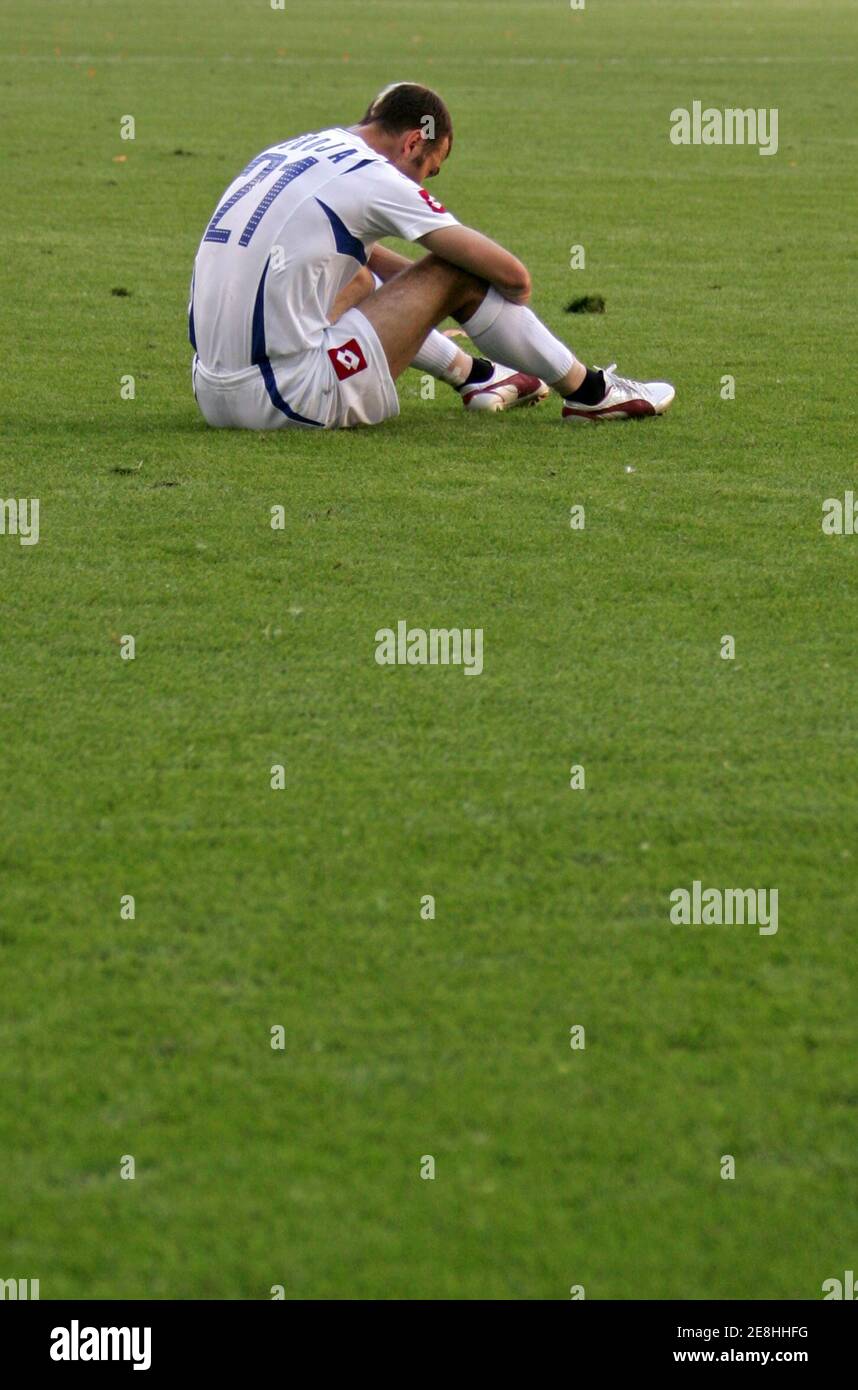 Serbia and Montenegro's Danijel Ljuboja sits on the pitch after they lost their Group C World Cup 2006 soccer match against the Netherlands in Leipzig June 11, 2006.  FIFA RESTRICTION - NO MOBILE USE    (GERMANY)     REUTERS/Wolfgang Rattay Stock Photo