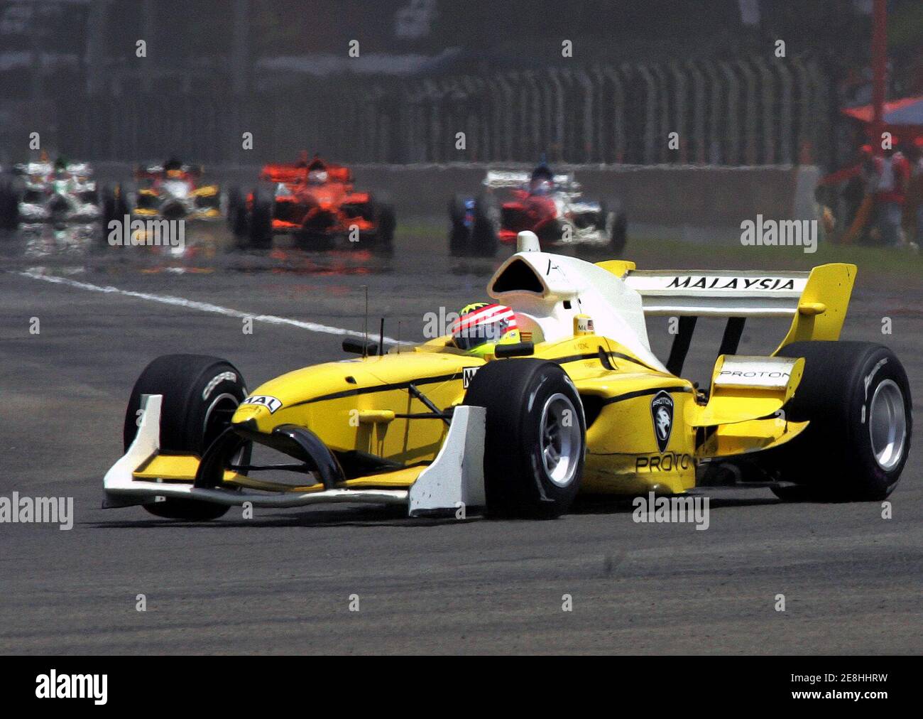 Malaysia's Alex Yoong drives his car during the feature race of the A1 Grand Prix Championship at the Sentul circuit in Bogor, West Java province, Indonesia February 12, 2006. Canada's Sean McIntosh won the feature race ahead of Yoong in second place and Australia's Marcus Marshall who finished third. REUTERS/Beawiharta Stock Photo