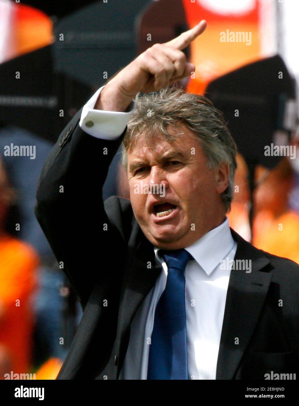 Australia's Dutch-born coach Guus Hiddink gestures during the international friendly soccer match against the Netherlands in Rotterdam, the Netherlands June 4, 2006.   WORLD CUP 2006 PREVIEW       REUTERS/Jerry Lampen   (NETHERLANDS) Stock Photo