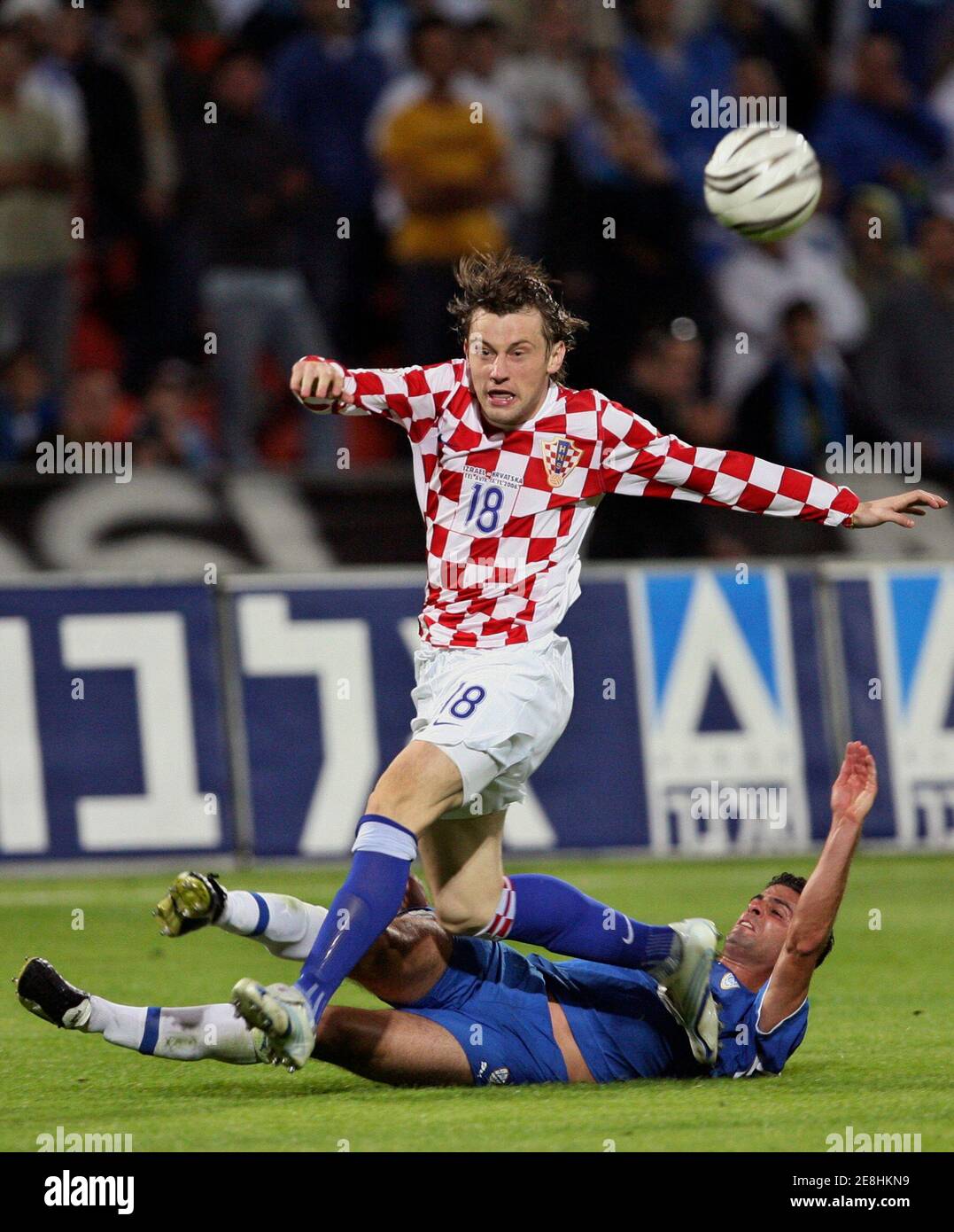 Croatia's Ivica Olic (top) is tackled by Israel's Adoram Keisi during their Group E Euro 2008 qualifying soccer match at Ramat Gan stadium in Tel Aviv, November 15, 2006.      REUTERS/Oleg Popov   (ISRAEL) Stock Photo
