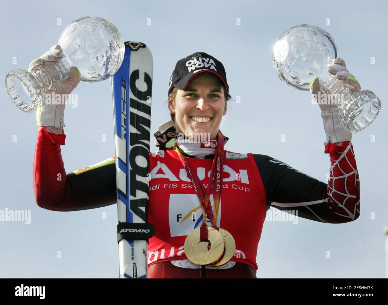 Michaela Dorfmeister of Austria shows her women's super-G and downhill World Cup trophys and her Torino 2006 Olympic Winter Games downhill and super-G gold medals following the season's last super-G World Cup race at the Alpine Skiing World Cup Finals in Are, Sweden March 16, 2006. Stock Photo