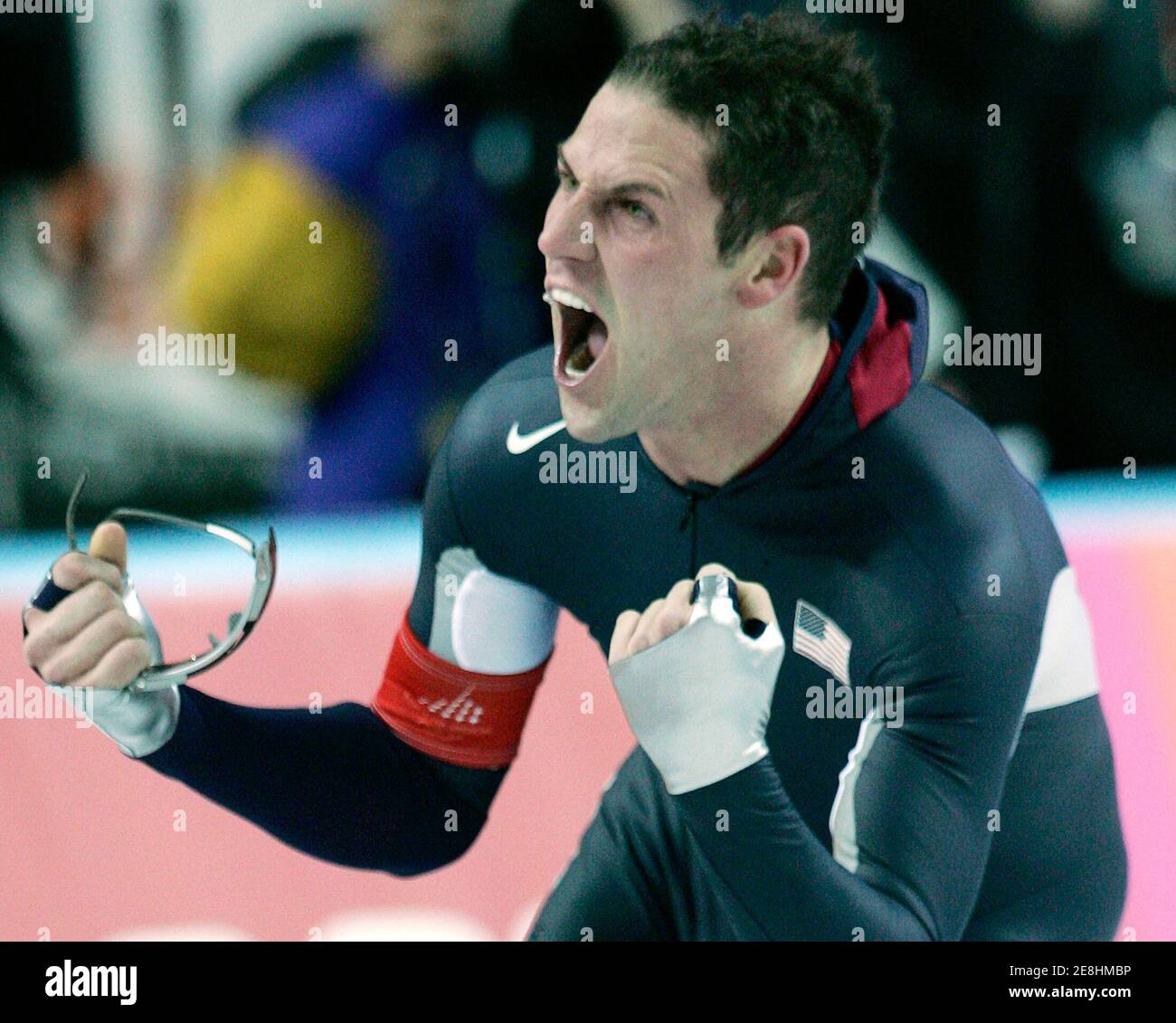 Chad Hedrick from the U.S. celebrates after winning the men's speed skating 5000 metres race at the Torino 2006 Winter Olympic Games in Turin, Italy February 11, 2006. Hedrick won the gold medal. REUTERS/Andy Clark Stock Photo