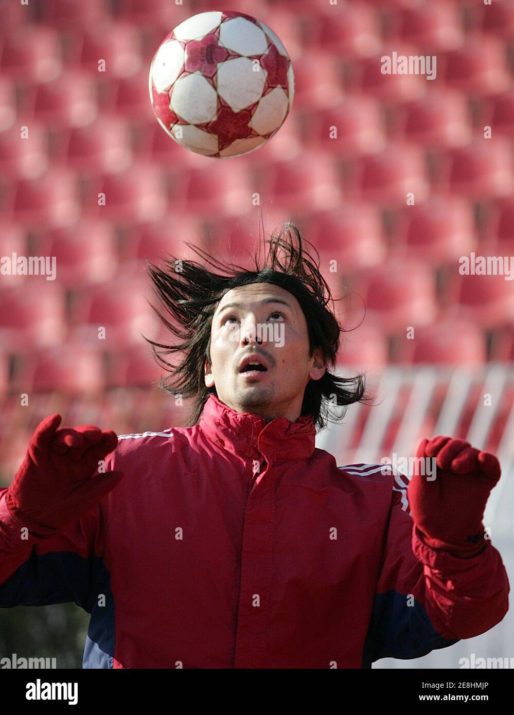 Japanese national soccer team striker Takayuki Suzuki plays with a ball during a training session January 27, 2006, in Belgrade after signing a two-year contract with former European champions Red Star Belgrade soccer club. REUTERS/Ivan Milutinovic Stock Photo