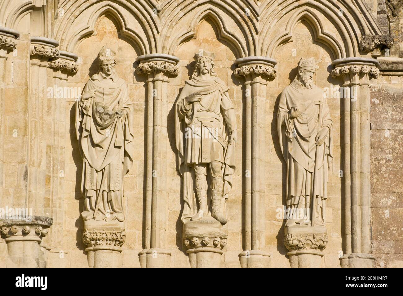 Saints Alphege, Edmund the Martyr and Thomas of Canterbury statues at Salisbury Cathedral, Wiltshire. The statues were sculpted by James Redfern in 18 Stock Photo