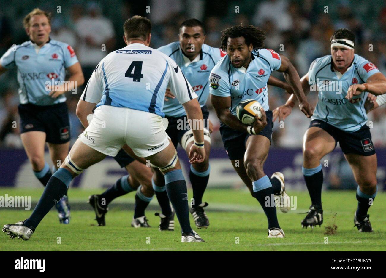Lote Tuqiri of the NSW Waratahs from Australia (2nd R) is supported by team mates Brett Sheehan (L) Wycliff Palu (3rd L) and Al Baxter (R) as he faces the defence of Bakkies Botha of the Bulls from South Africa during their Super 14 rugby match in Sydney March 10, 2007. REUTERS/Will Burgess   (AUSTRALIA) Stock Photo