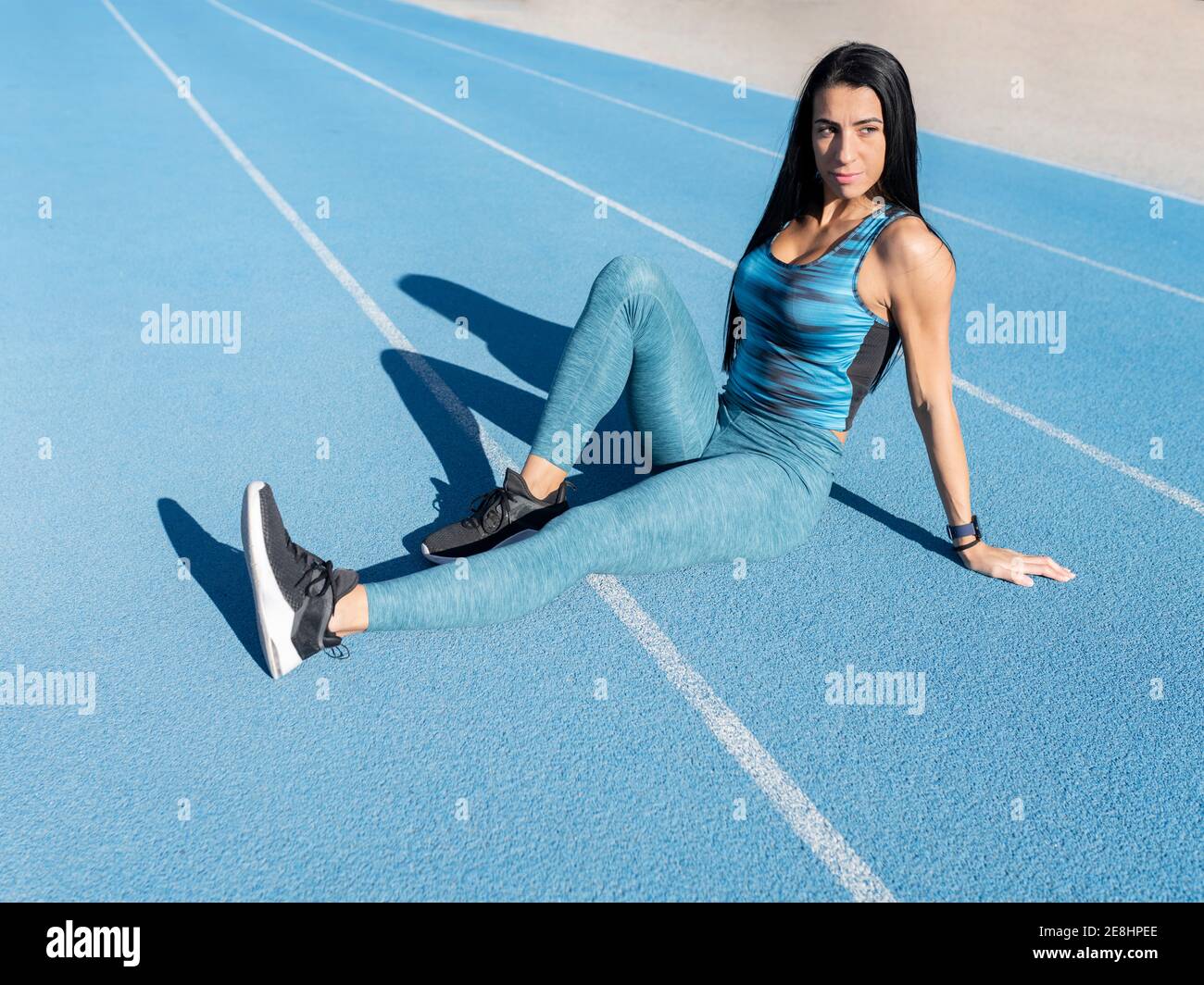 Full body of strong female powerlifter practicing deadlift exercise