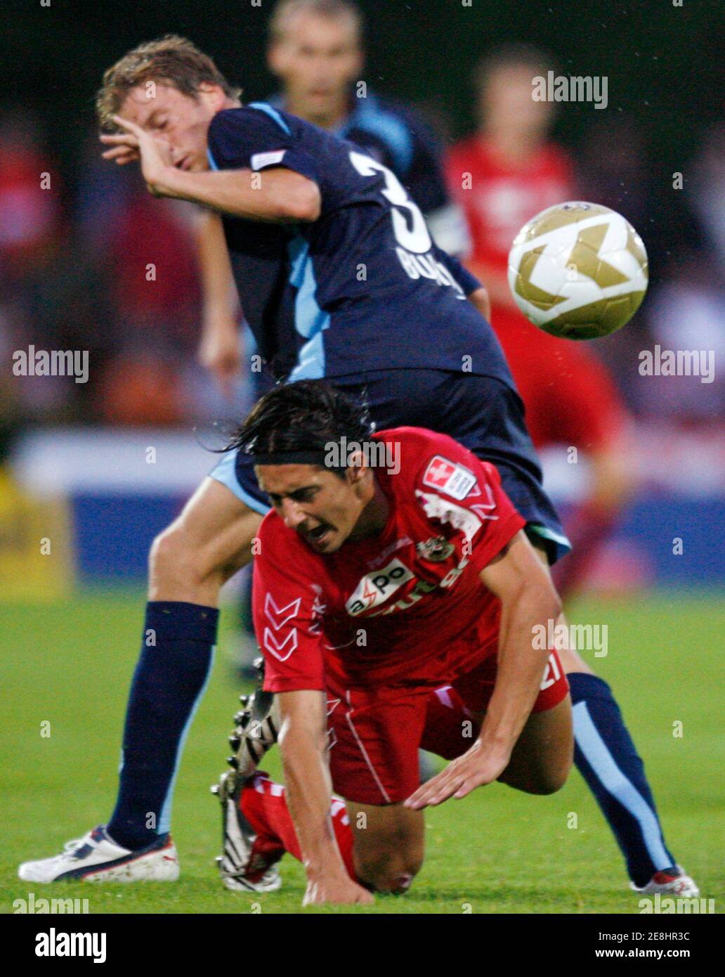 FC Thun's Nelson Ferreira (front) challenges FC Sion's Arnaud Buehler during their Swiss Super League soccer match in Thun August 7, 2007. REUTERS/Pascal Lauener (SWITZERLAND) Stock Photo