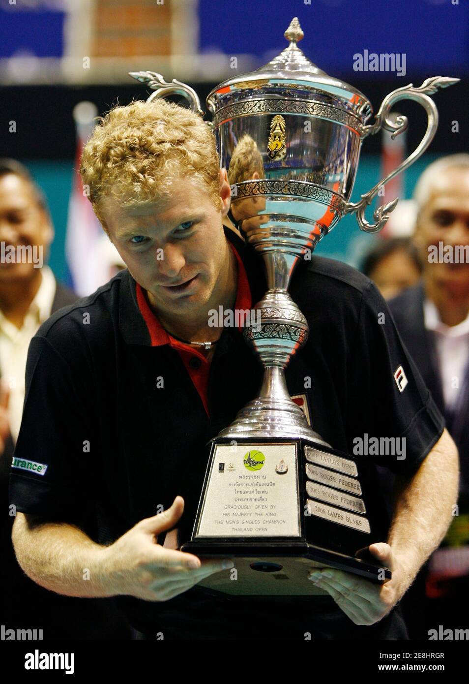 Dmitry Tursunov of Russia holds the trophy after winning the final match against Germany's Benjamin Becker at the Thailand Open 2007 in Bangkok, September 30, 2007.     REUTERS/Chaiwat Subprasom  (THAILAND) Stock Photo