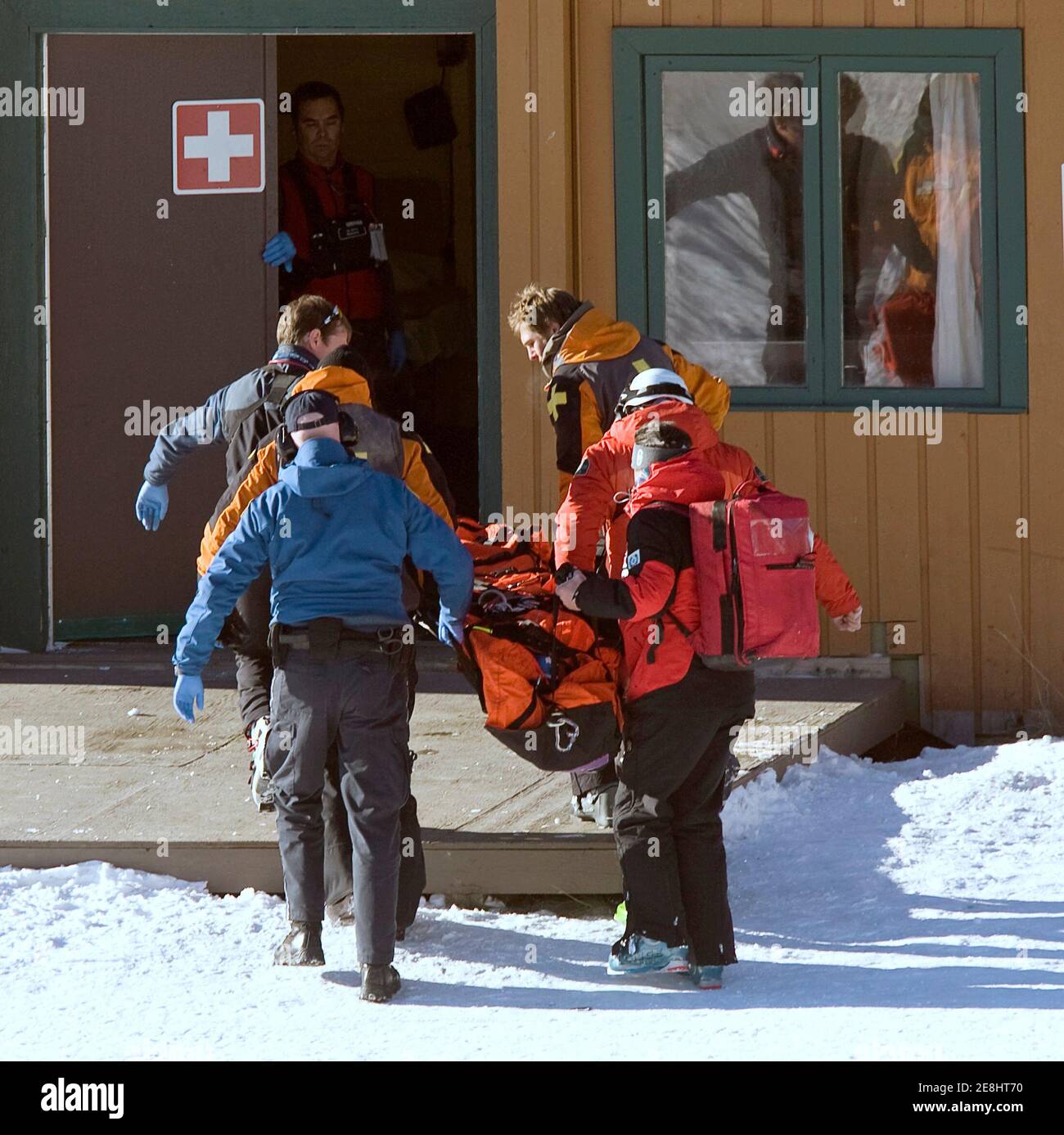 Medics carry Tamara Wolf of Switzerland following her airlift down the ski hill after crashing during the women's World Cup Downhill training in Lake Louise, Alberta, November 29, 2007.     REUTERS/Andy Clark     (CANADA) Stock Photo