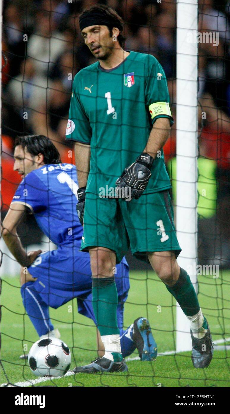 Italy's goalkeeper Gianluigi Buffon (R) and team mate Gianluca Zambrotta react after a goal scored by Netherlands' Giovanni van Bronckhorst (not pictured) during their Group C Euro 2008 soccer match at the Stade de Suisse Stadium in Bern, June 9, 2008.     REUTERS/Jerry Lampen (SWITZERLAND) MOBILE OUT. EDITORIAL USE ONLY Stock Photo