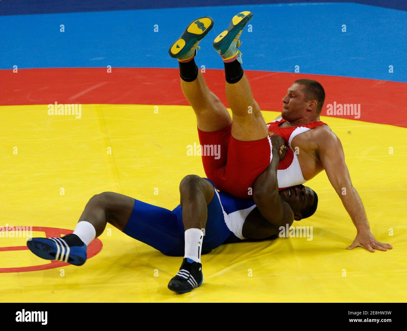 Khasan Baroev of  Russia (in red) fights Mijain Lopez of Cuba during their 120kg men's Greco-Roman wrestling final bout at the Beijing 2008 Olympic Games August 14, 2008.     REUTERS/Oleg Popov (CHINA) Stock Photo