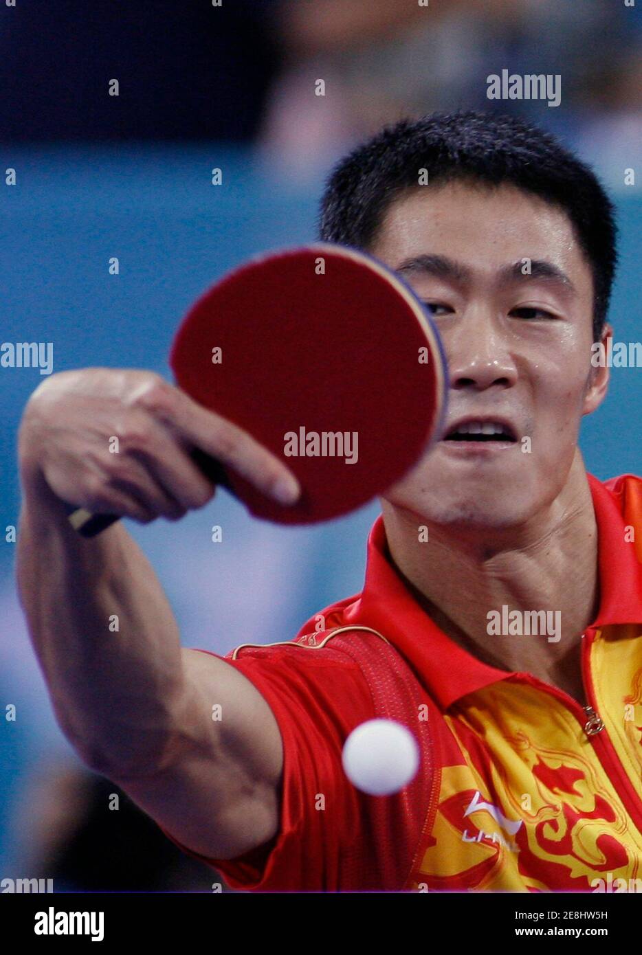 Wang Liqin of China plays a shot during his men's singles quarterfinals table tennis match against Tan Ruiwu of Croatia at the Beijing 2008 Olympic Games, August 22, 2008.    REUTERS/Beawiharta (CHINA) Stock Photo