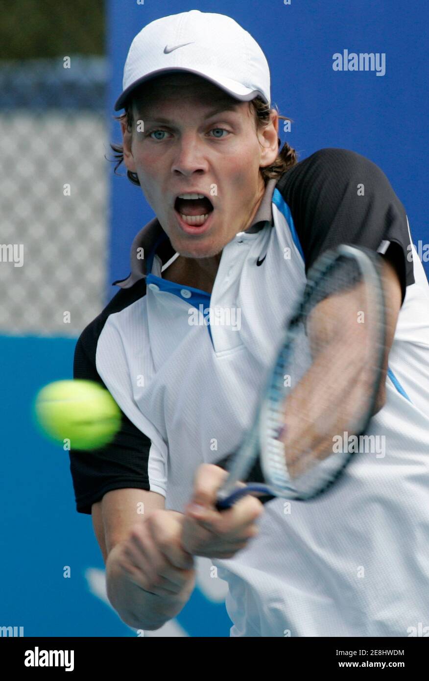 Tomas Berdych of Czech Republic hits a shot against Filippo Volandri of Italy during their match at the Sydney International tennis tournament January 7, 2008. REUTERS/Will Burgess     (AUSTRALIA) Stock Photo
