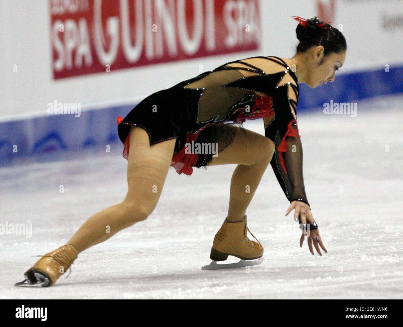 Japan's Miki Ando falls during the women's free skating program at the ISU Four Continents Figure Skating Championships in Goyang, northwest of Seoul, February 16, 2008. Ando won the bronze medal.       REUTERS/Jo Yong-Hak (SOUTH KOREA) Stock Photo