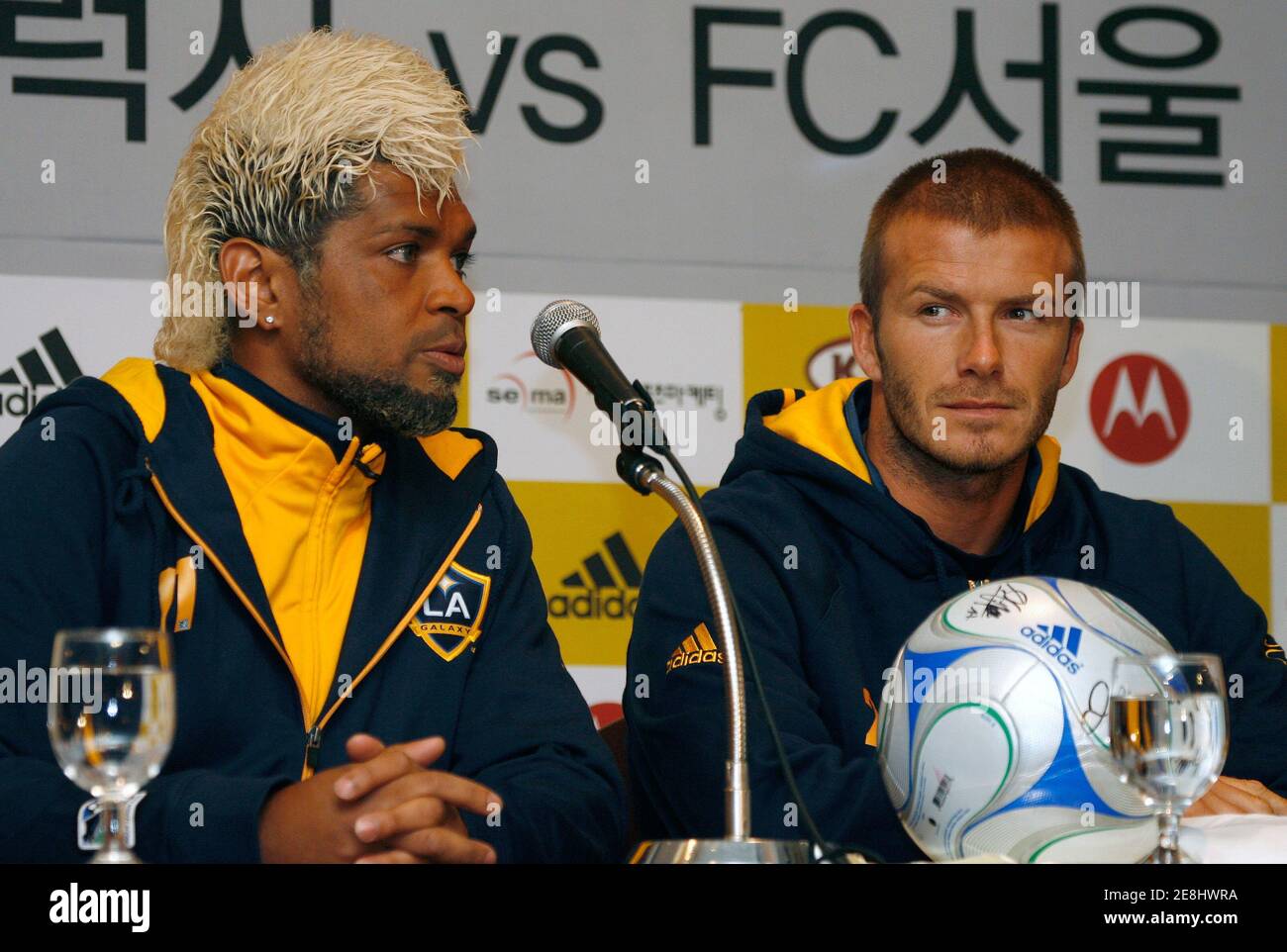 Los Angeles Galaxy's David Beckham (R) looks at his teammate Abel Xavier during a news conference in Seoul February 27, 2008.  REUTERS/Jo Yong-Hak (SOUTH KOREA) Stock Photo