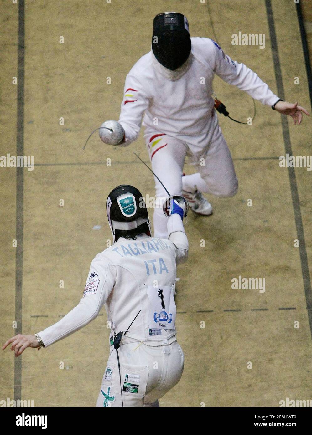Jose Luis Abajo of Spain (top) fights with Matteo Tagliariol of Italy during the men's epee individual final at the World Cup Fencing tournament Grand Prix de Berne in Bern March 2, 2008. Tagliariol won the tournement. REUTERS/Pascal Lauener (SWITZERLAND) Stock Photo