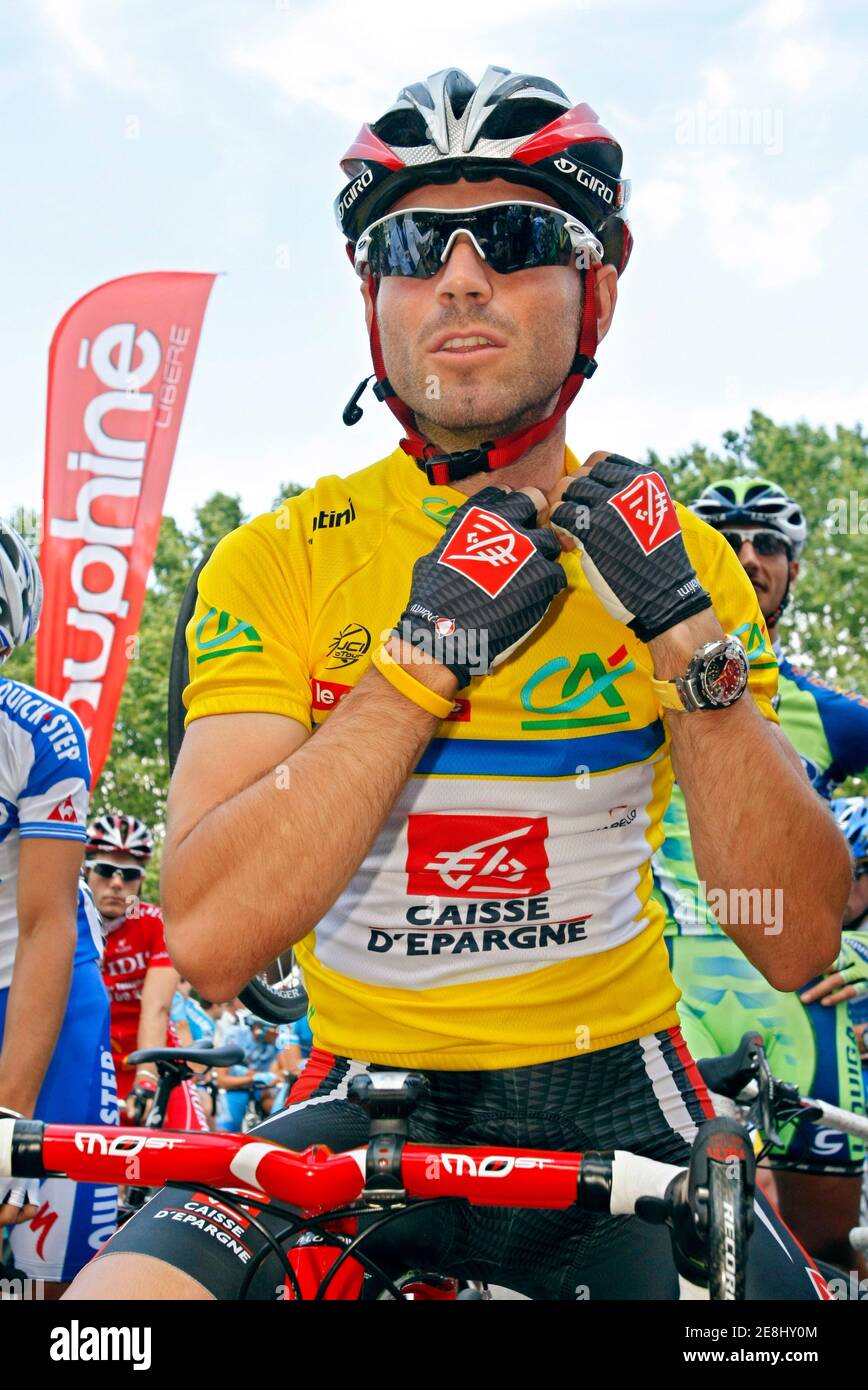 Leader of the race Alejandro Valverde of Spain adjusts his helmet before the start of the fourth stage of the Dauphine cycling race between Vienne and Annemasse, French Alps, June 12, 2008.  REUTERS/Robert Pratta (FRANCE) Stock Photo