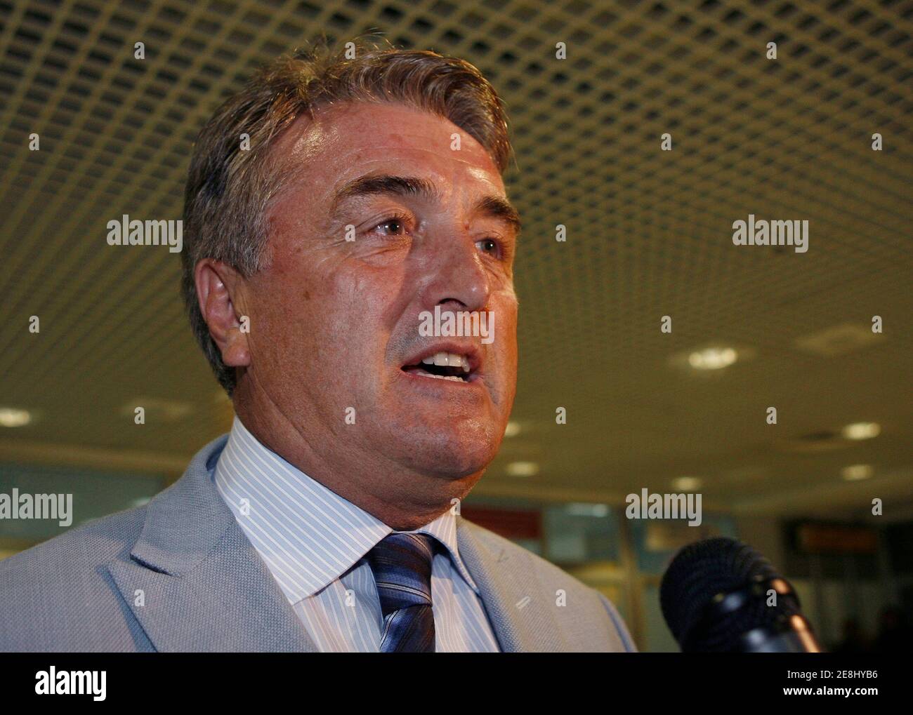 Serbia's new soccer coach Radomir Antic answers questions upon his arrival at Belgrade's airport August 24, 2008. REUTERS/Ivan Milutinovic  (SERBIA) Stock Photo