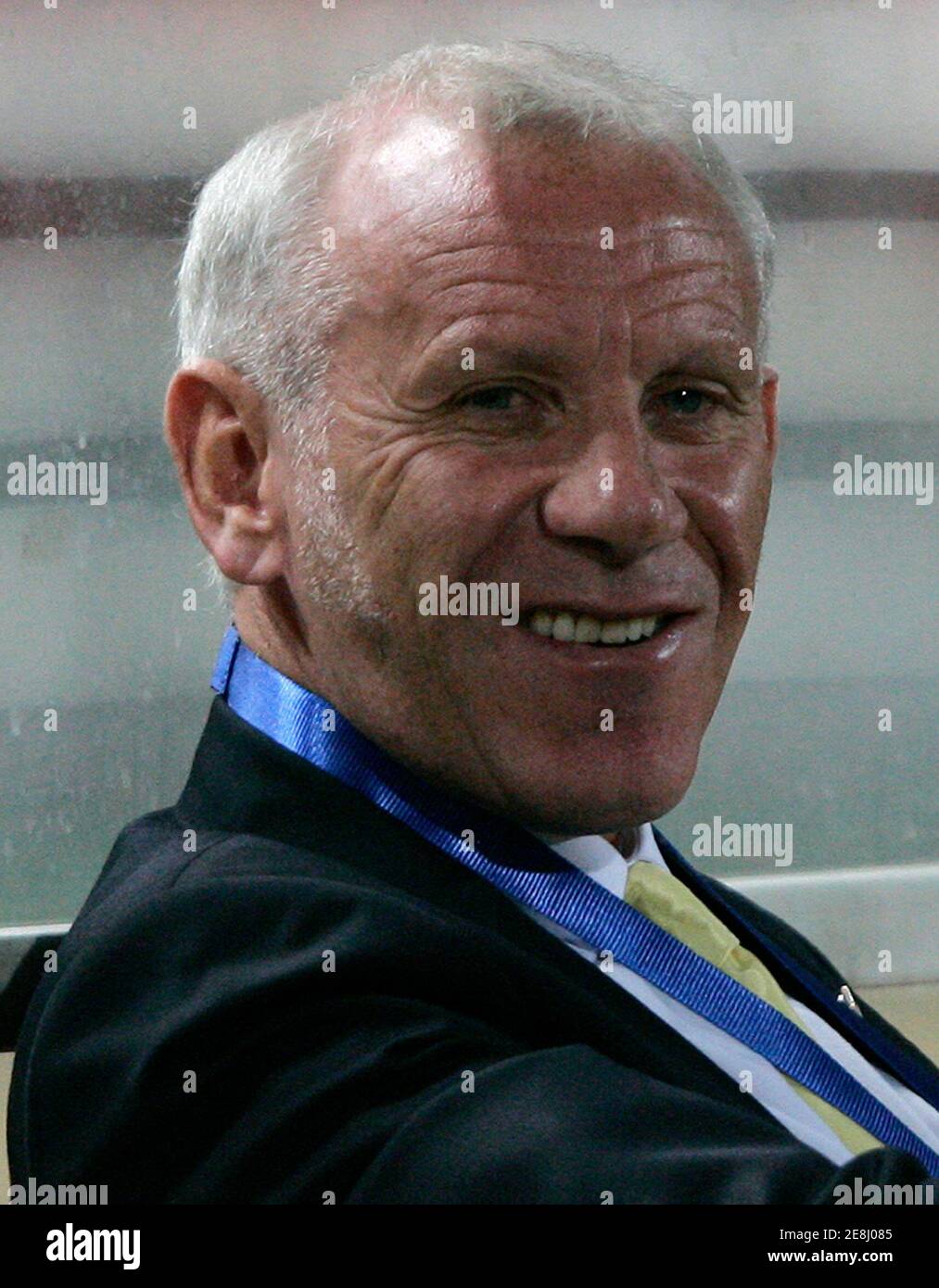 Thailand's soccer coach Peter Reid smiles during the Asean Football Federation Suzuki Cup 2008 semi-final soccer match between Thailand and Indonesia at the Rajamangala national stadium in Bangkok December 20, 2008. REUTERS/Chaiwat Subprasom (THAILAND) Stock Photo