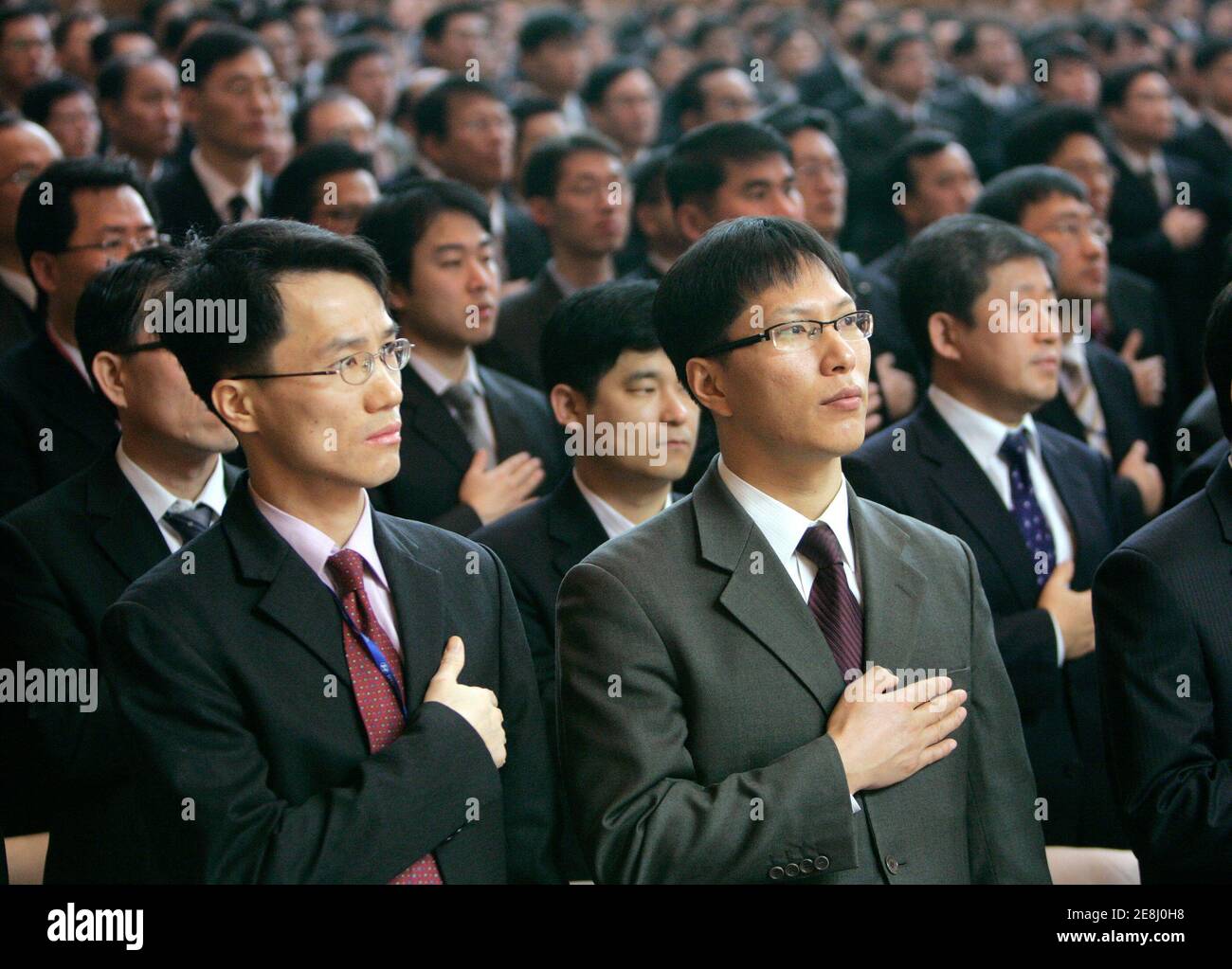 Employees of Hyundai Motor take part in a ceremony to mark the new year at the company headquarters in Seoul January 2, 2009. South Korean automakers' combined sales in December fell from a year ago, data showed on Friday, adding more concerns over the slowing world's car demand on a global recession and the financial crisis.  REUTERS/Jo Yong-Hak (SOUTH KOREA) Stock Photo