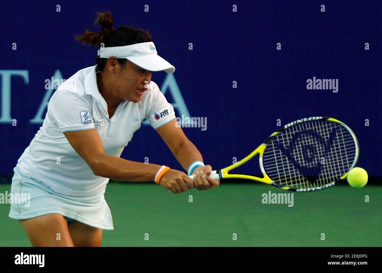 Thailand's Tamarine Tanasugarn returns a shot to Uzbekistan's Akgul Amanmuradova at the PTT Pattaya Women's Open tennis tournament February 11, 2009.  REUTERS/Chaiwat Subprasom (THAILAND) Stock Photo