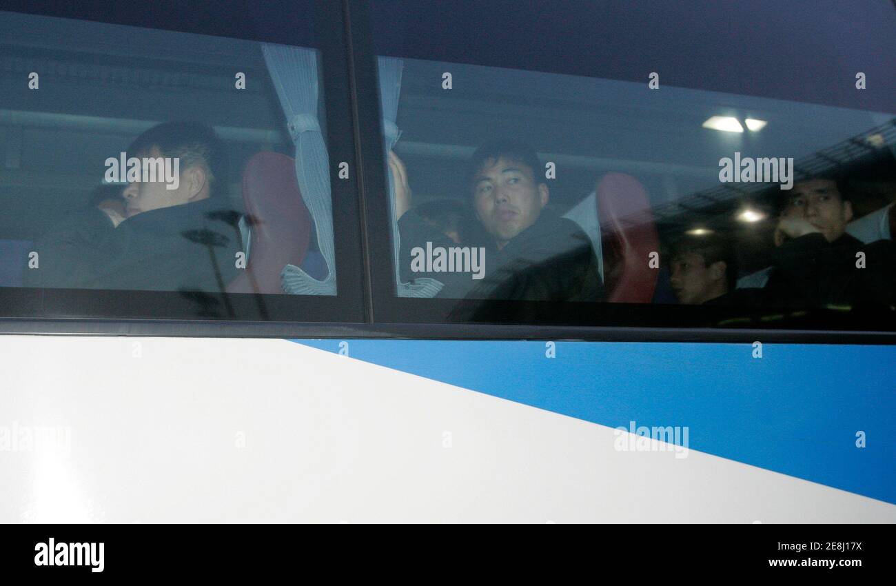 Members of North Korean national soccer team look outside as they ride on a bus upon their arrival at the Incheon international airport, west of Seoul, March 29, 2009. The North Korean team arrived in South Korea on Sunday for the 2010 FIFA World Cup Asia qualifying soccer match to be held in Seoul on April 1, 2009.  REUTERS/Jo Yong-Hak (SOUTH KOREA SPORT SOCCER) Stock Photo