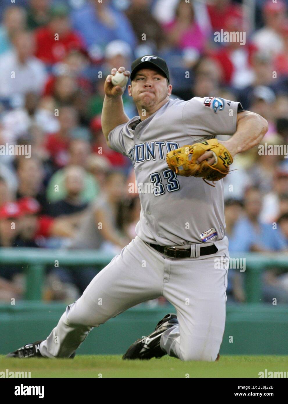 Toronto Blue Jays third baseman Scott Rolen throws from his knees in an attempt to put out Washington Nationals batter Elijah Dukes (not pictured) in the second inning of their MLB interleague baseball game in Washington June 20, 2009. Dukes was safe on an infield single.   REUTERS/Gary Cameron (UNITED STATES SPORT BASEBALL) Stock Photo
