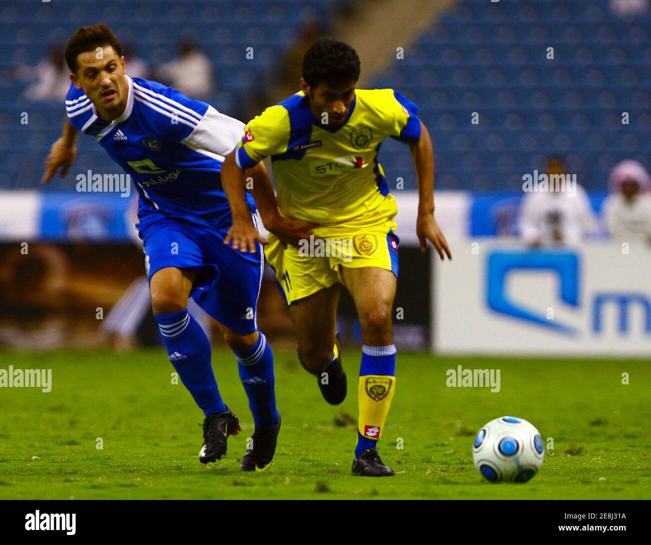 Al-Hilal's Christian Wilhelmsson (L) fights for the ball with Al Nasr's Saad Al Harthi during their Saudi Super League soccer match in Riyadh September 29, 2009. REUTERS/Fahad Shadeed     (SAUDI ARABIA SPORT SOCCER) Stock Photo