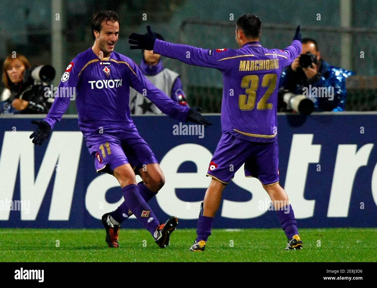Fiorentina Alberto Gilardino (L) celebrates after scoring with his teammate Marco Marchionni during their Champions League soccer match against Debrecen at the Artemio Franchi stadium in Florence November 4, 2009. REUTERS/Alessandro Bianchi   (ITALY SPORT SOCCER) Stock Photo