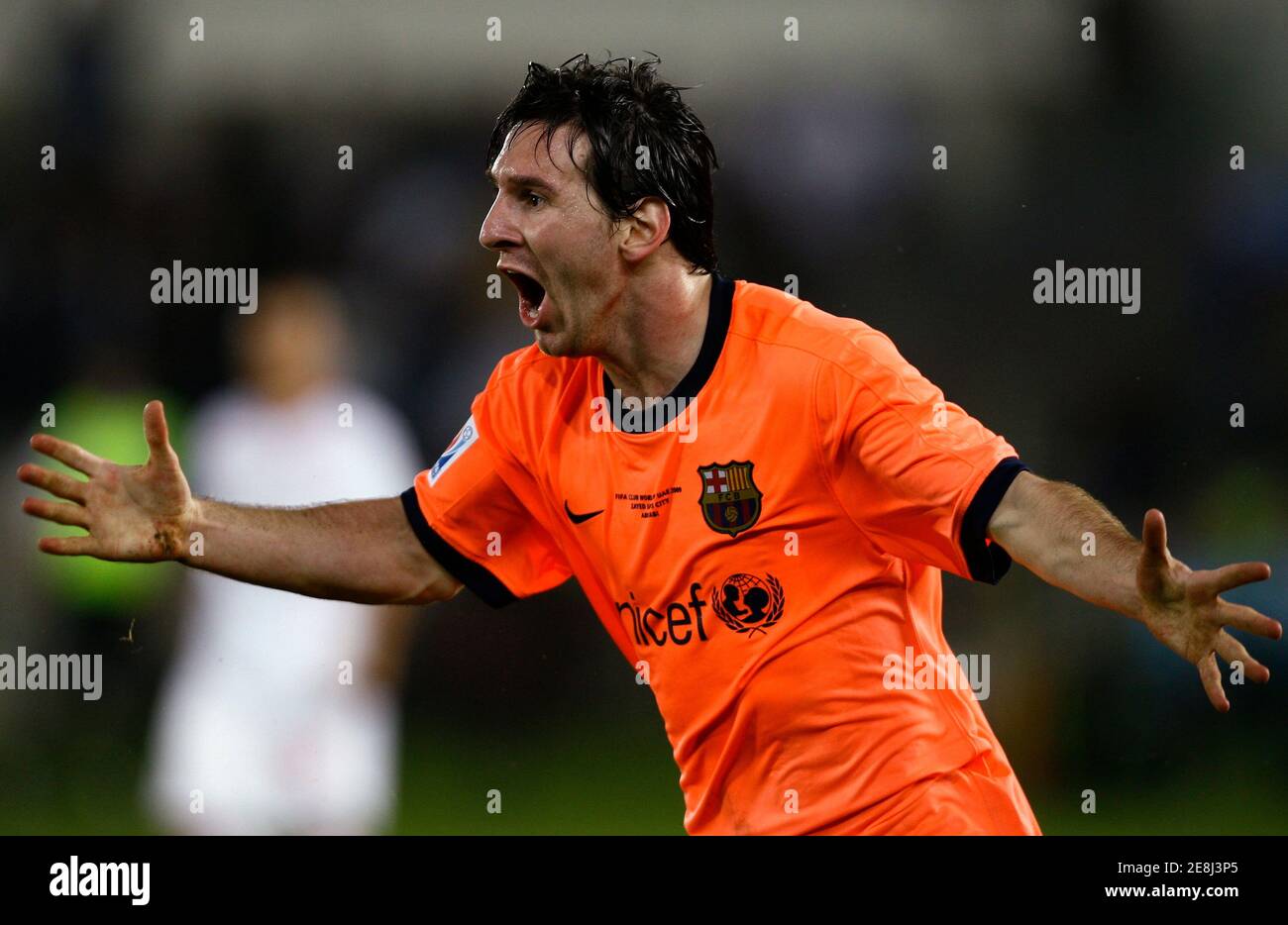 Barcelona's Lionel Messi celebrates his goal during their FIFA Club World Cup final soccer match against Estudiantes at Zayed Sports City stadium in Abu Dhabi December 19, 2009.   REUTERS/Fahad Shadeed (UNITED ARAB EMIRATES - Tags: SPORT SOCCER) Stock Photo