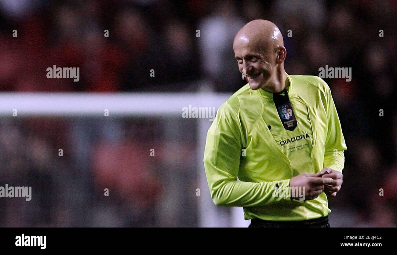 Former FIFA soccer referee Pierluigi Collina of Italy smiles during the  seventh "Match against Poverty" at Luz stadium in Lisbon January 25, 2010.  With tickets at 10 euros each, the match will