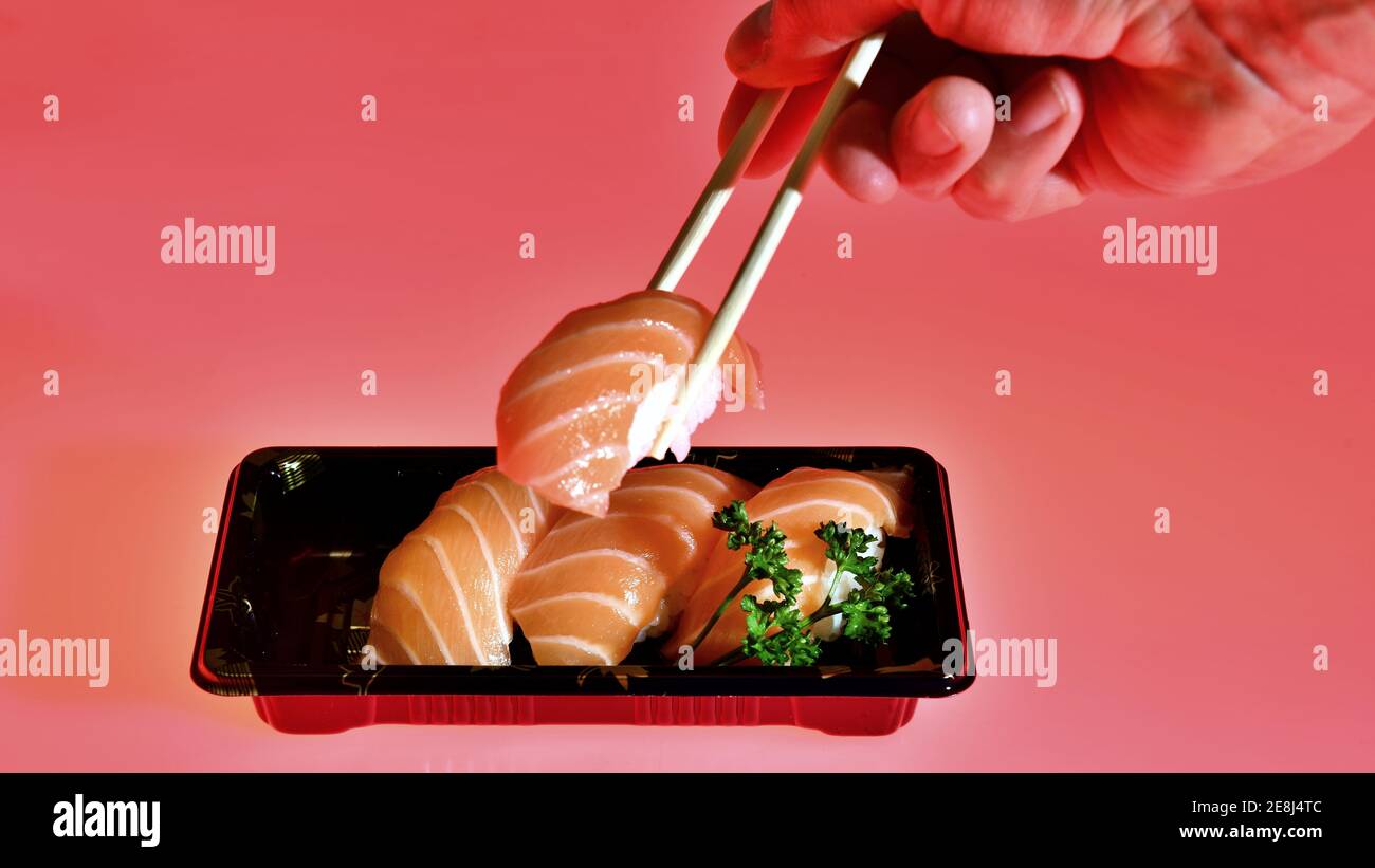 Salmon sushi nigiri in bamboo sticks Stock Photo