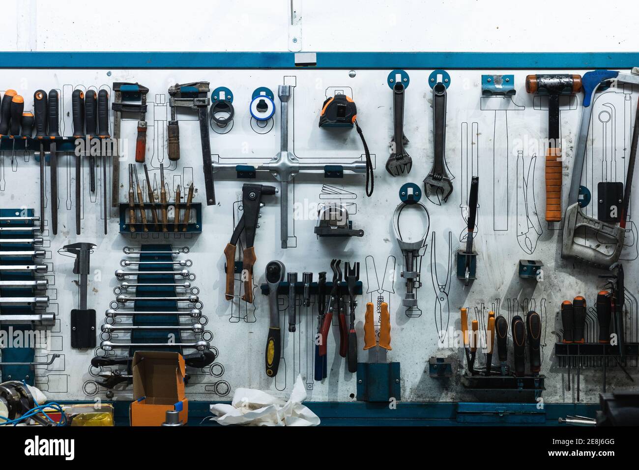 Set of screwdrivers and wrenches hanging on wall with assorted auto  mechanic tools in garage Stock Photo - Alamy