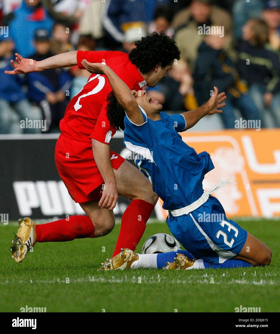 Paraguay's Nelson Cuevas (R) is fouled by Georgia's Jaba Kankava during their friendly soccer match in Dornbirn, Austria May 31, 2006.  WORLD CUP 2006 PREVIEW    REUTERS/Miro Kuzmanovic Stock Photo