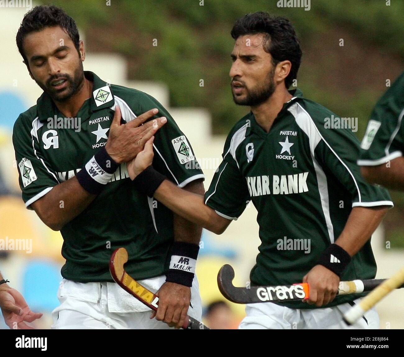 Pakistan's Sohail Abbas (L) and Shakeel Abbasi (R) celebrate after scoring against Japan during their Men's Field Hockey World Cup match at the Warsteiner Hockey Park stadium in Moenchengladbach September 7, 2006. REUTERS/Pascal Lauener  (GERMANY) Stock Photo