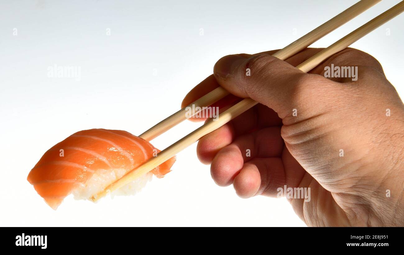 Salmon sushi nigiri in bamboo sticks Stock Photo