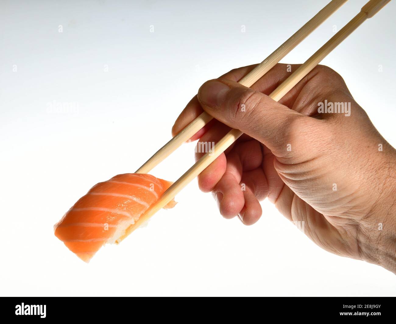 Salmon sushi nigiri in bamboo sticks Stock Photo