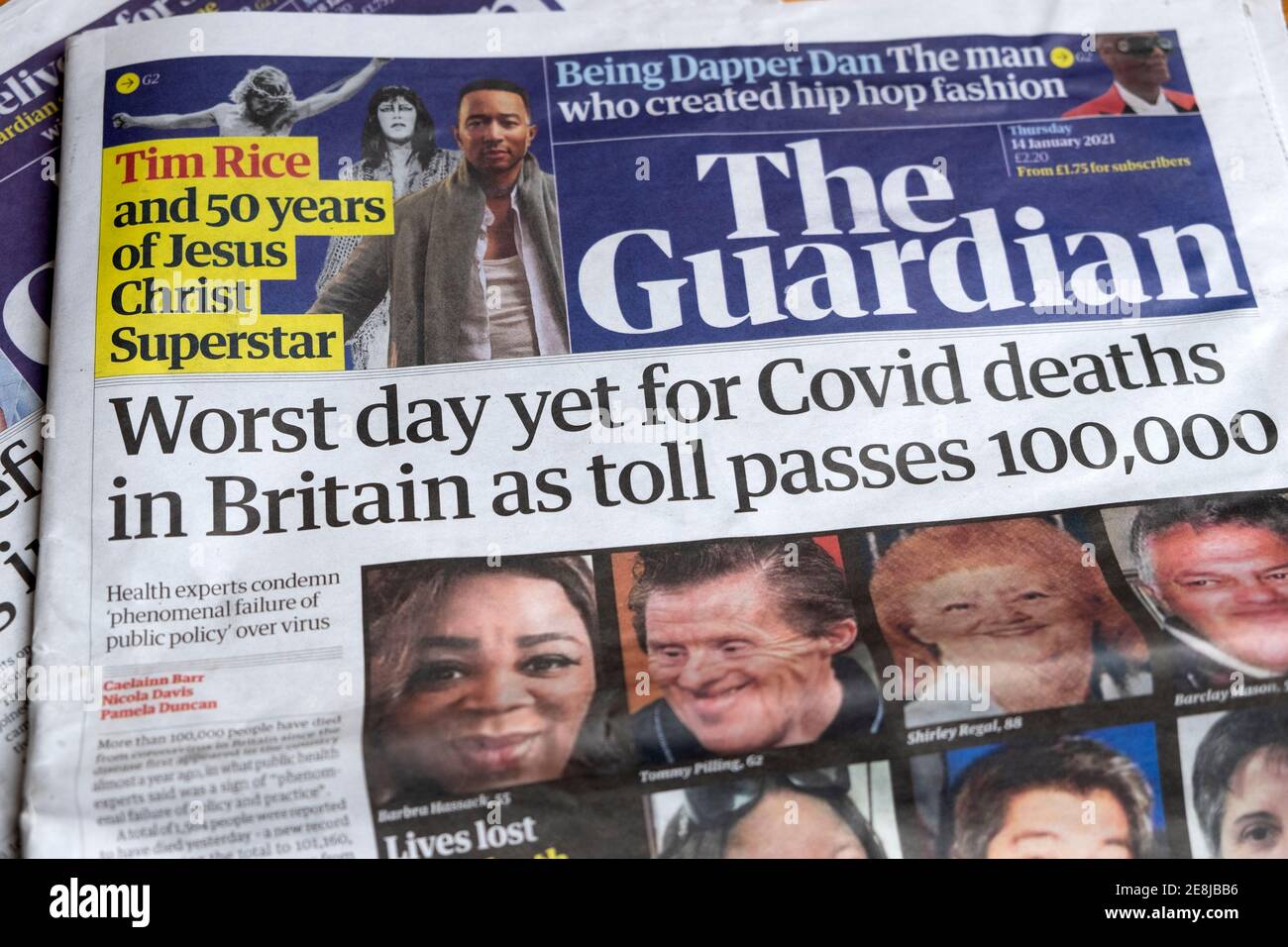 'Worst day yet for Covid deaths in UK as toll passes 100,000 milestone' Guardian news coronavirus covid 19 newspaper headline 14 January London UK Stock Photo