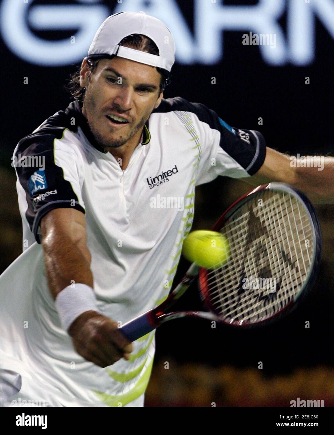 Germany's Tommy Haas returns a shot during his semi-final match against Chile's Fernando Gonzalez at the Australian Open tournament in Melbourne January 2007. REUTERS/Stuart Milligan (AUSTRALIA Stock Photo - Alamy