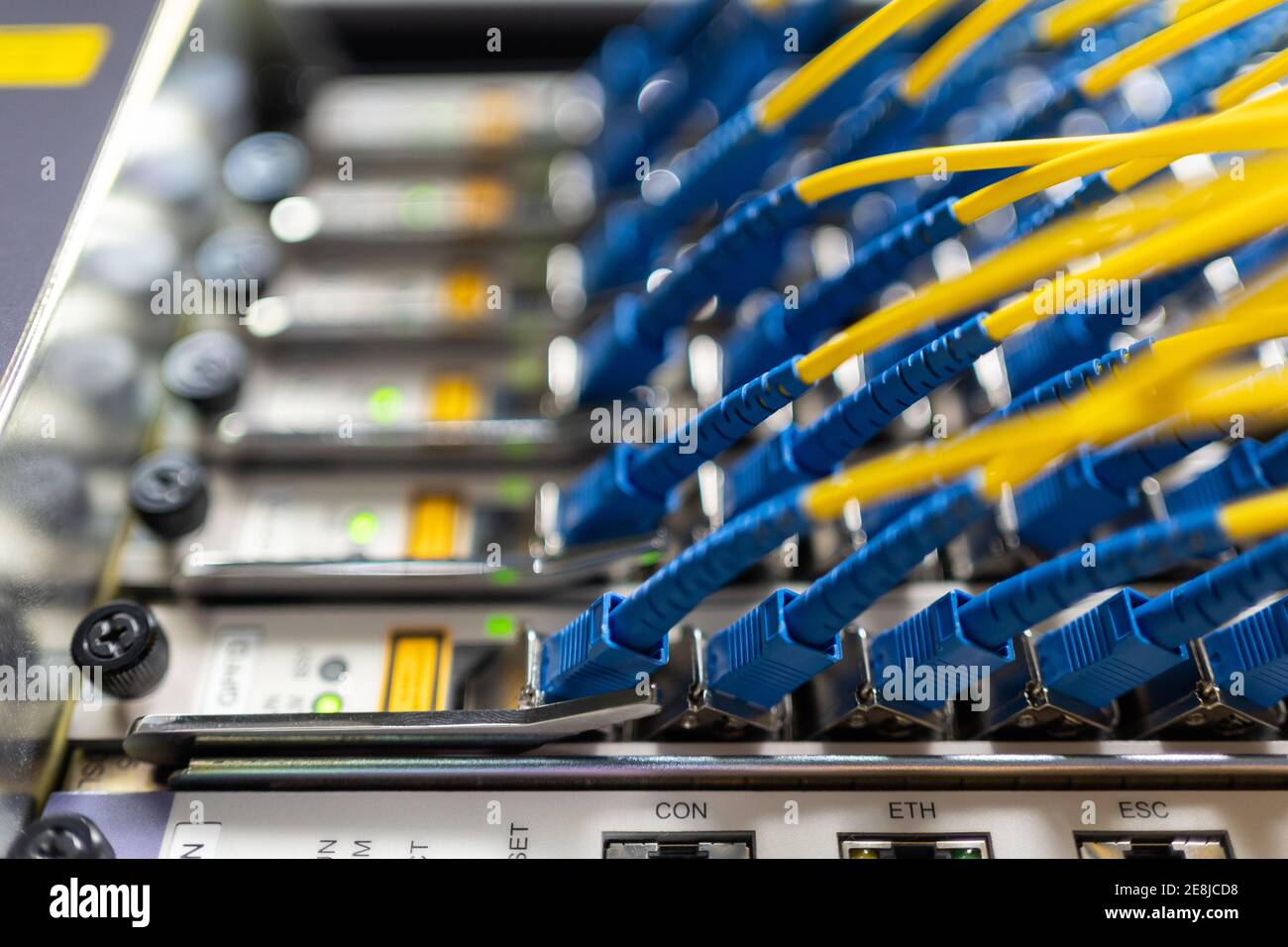 Control panel of optical fiber wires installed in communications room for providing process and network access Stock Photo