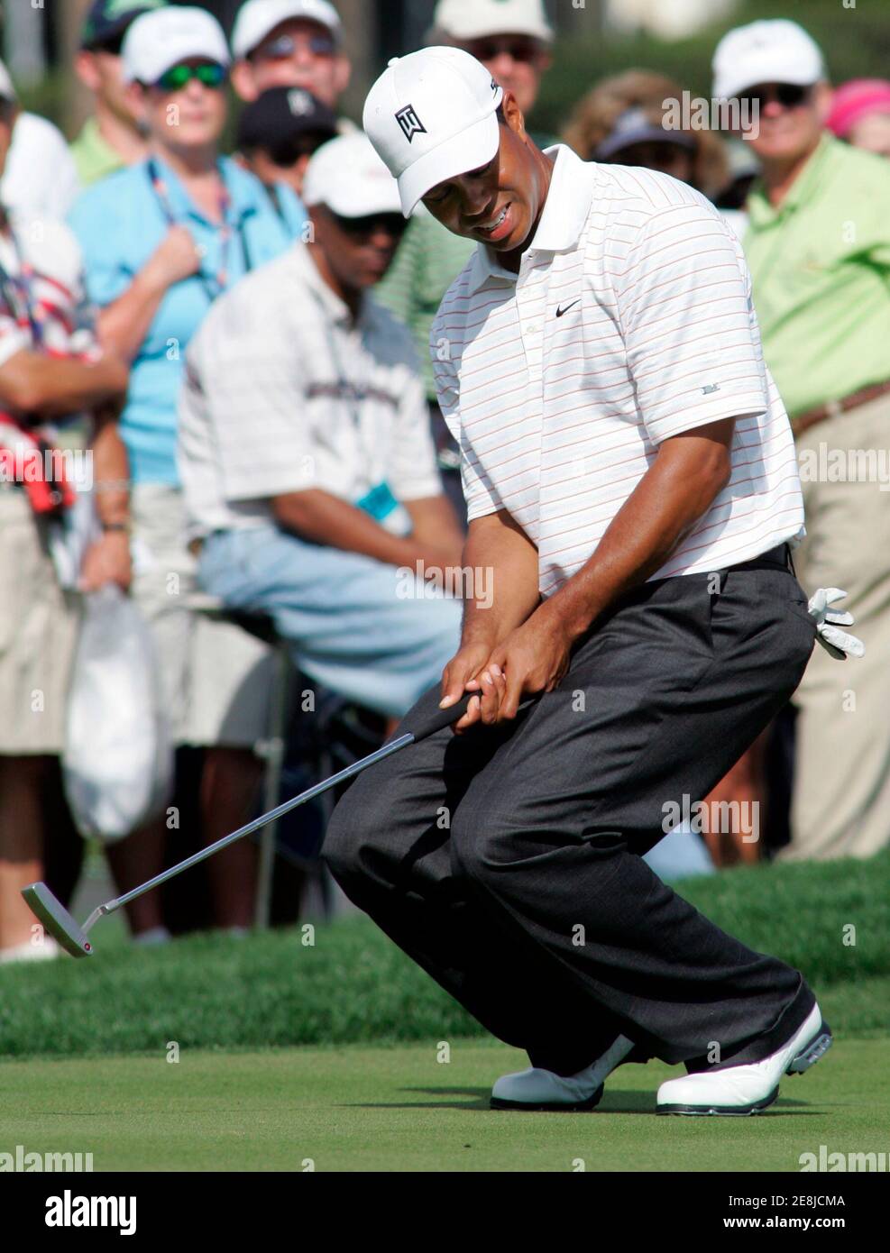 Tiger Woods reacts after missing a putt on the 16th hole during the first round of the Arnold Palmer Invitational golf tournament held at the Bay Hill Club in Orlando, Florida March 15, 2007. REUTERS/Rick Fowler (UNITED STATES) Stock Photo
