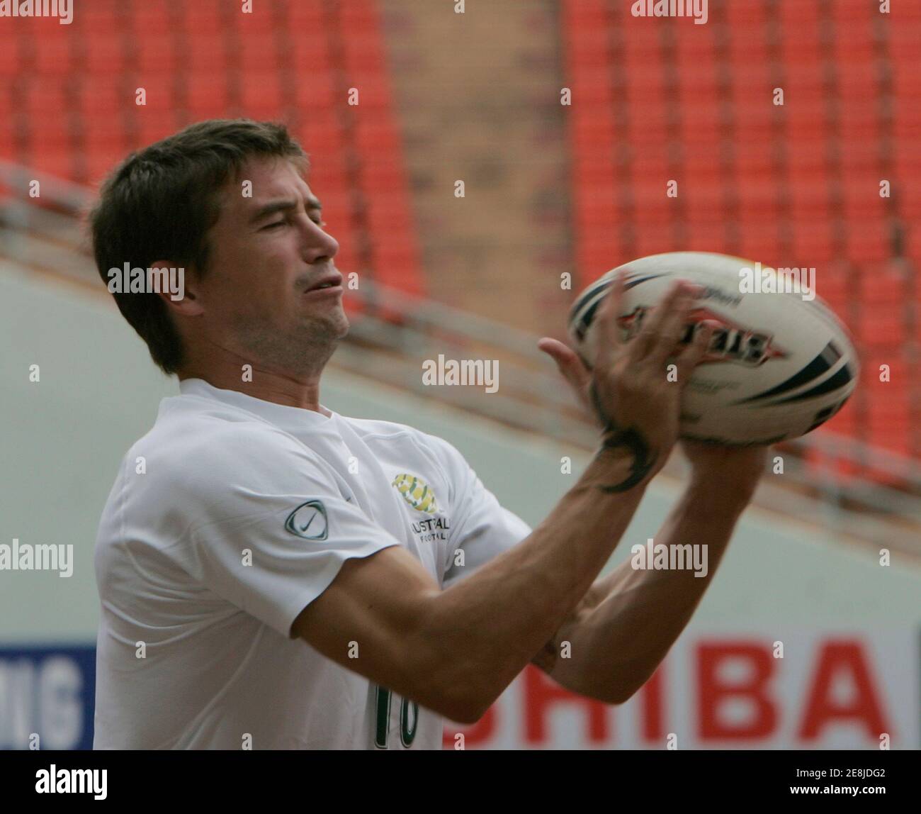 Australia's soccer player Harry Kewell plays with a football during a practice session for the upcoming AFC Asian Cup 2007 in Bangkok July 5, 2007. Australia is scheduled to play Oman in the Asian Cup on July 8.   REUTERS/Chaiwat Subprasom  (THAILAND) Stock Photo