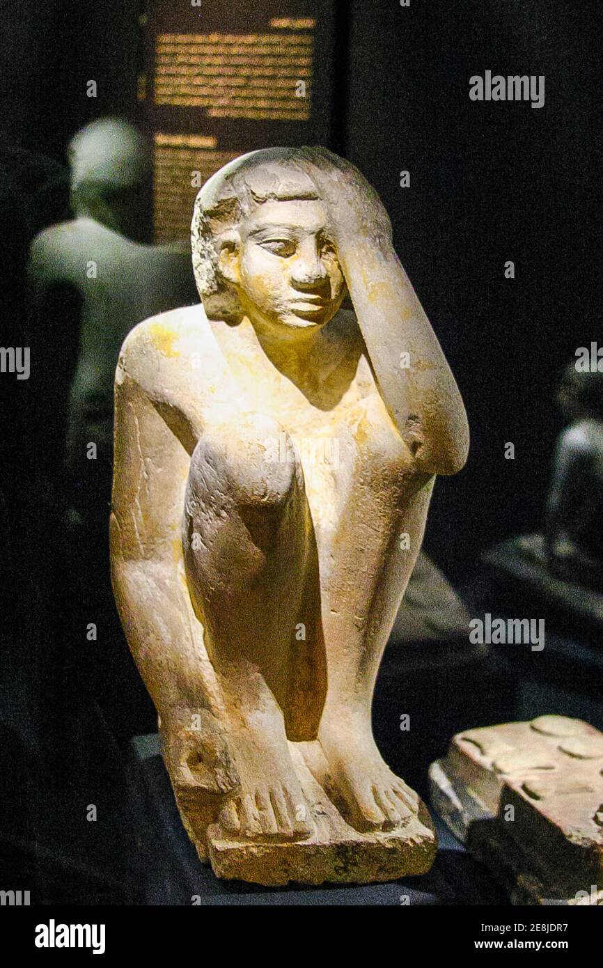 Egypt, Alexandria, National Museum, model statuette of a servant cooking and protecting his head from fire. Stock Photo