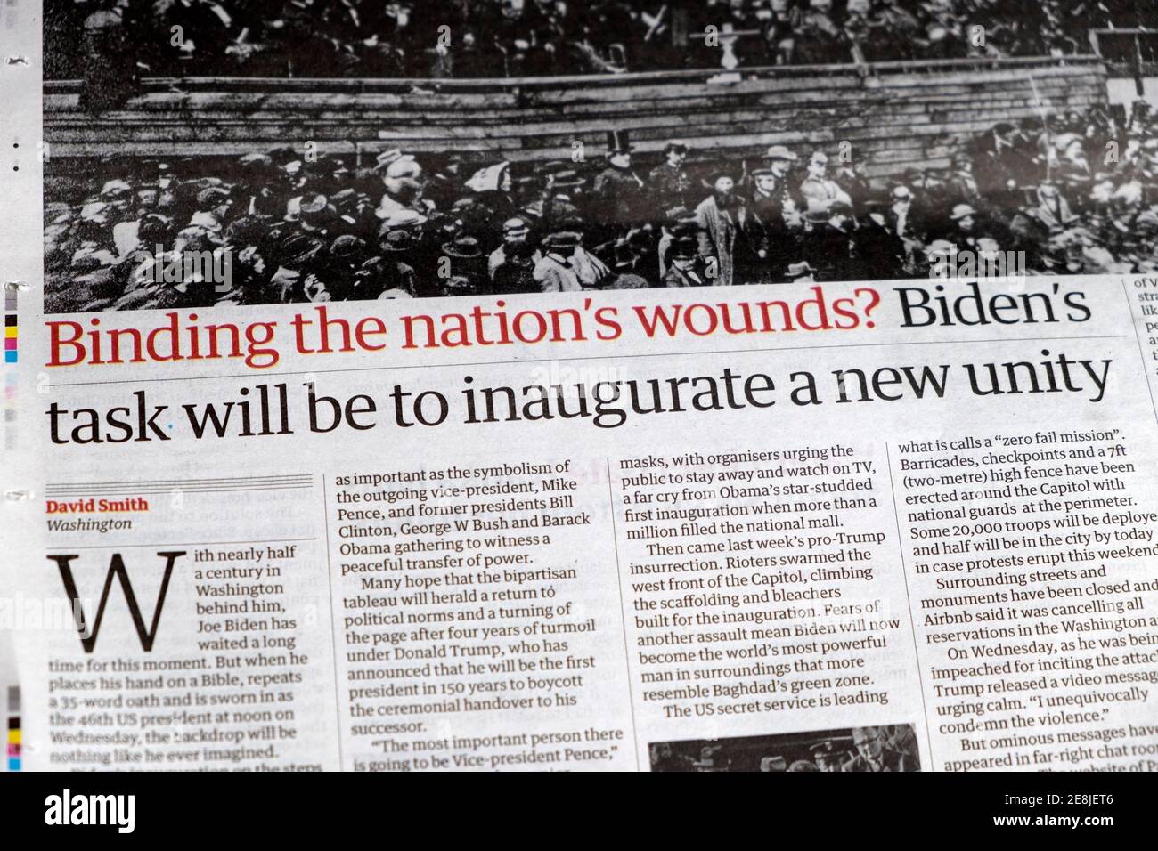 'Binding the nation's wounds? Biden 's task will be to inaugurate a new unity'  newspaper article news headline in The Guardian 16 January 2021 UK Stock Photo