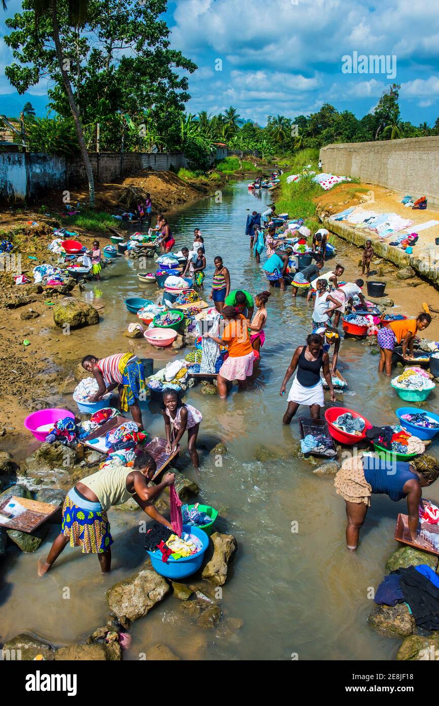 Women washing clothes in a river bed, City of Sao Tome, Sao Tome and